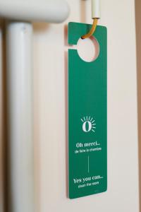 a green card hanging on a door at Hotel des Victoires - Restaurant in Cannes