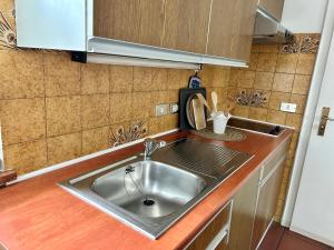 a kitchen counter with a sink in a kitchen at St. Vigilhof in Nalles +55 photos