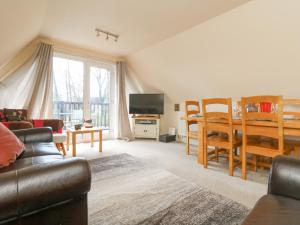 a living room with a couch and a table at Valley Lodge 44 in Callington