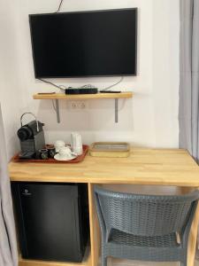 TV a/nebo společenská místnost v ubytování Bungalow Sweet escape