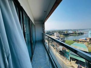 a balcony with a view of a river at Hotel Sonar Bangla in Rāngāmāti