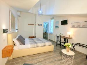 Postel nebo postele na pokoji v ubytování Il BorGhetto Guest House
