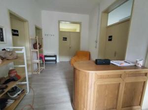 a room with a room with a desk and a room with a room at Ostello di Pontito in Lanciole