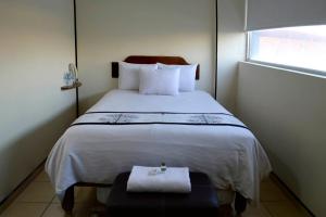 Postel nebo postele na pokoji v ubytování Hotel Mateos 1215