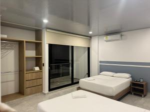 Postel nebo postele na pokoji v ubytování RB Hotel