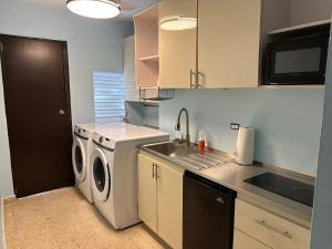 a kitchen with a sink and a washing machine at 3BR, 1BA in Cepeda, Up to 20 Guests near Ocean Park Beach in San Juan