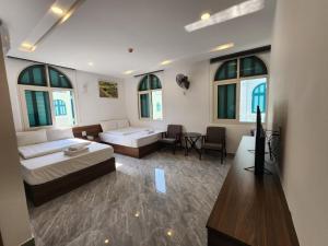 Postel nebo postele na pokoji v ubytování Kalia Hotel