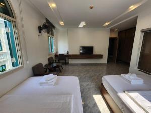 Postel nebo postele na pokoji v ubytování Kalia Hotel