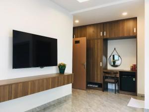TV a/nebo společenská místnost v ubytování Kalia Hotel