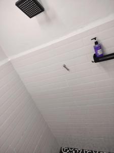a room with a white ceiling with a light at Maileyna Homestay 1.0 in Alor Setar