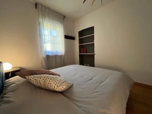 Postel nebo postele na pokoji v ubytování L'appartamento di ringhiera