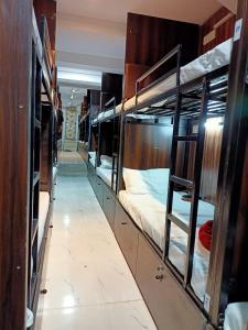 a row of bunk beds in a room at Golden View Dormitory in Mumbai
