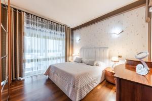 Katil atau katil-katil dalam bilik di Vollga Seafront Suite by PS