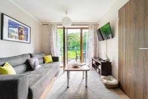 a living room with a couch and a table at B48 Duplex in Törökbálint