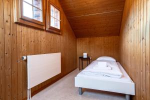 Voodi või voodid majutusasutuse Chalet Seehus Iseltwald toas