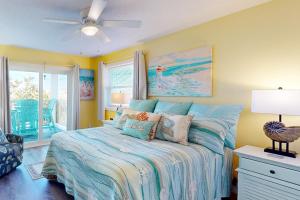 a bedroom with a bed and a ceiling fan at Sunset Terrace in Avon