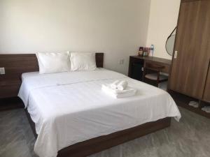 Postel nebo postele na pokoji v ubytování Kalia Hotel