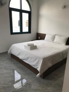Postel nebo postele na pokoji v ubytování Kalia Hotel