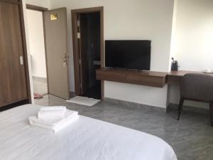 TV a/nebo společenská místnost v ubytování Kalia Hotel