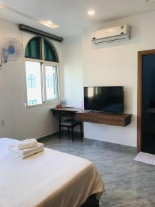 TV a/nebo společenská místnost v ubytování Kalia Hotel