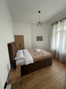 Postel nebo postele na pokoji v ubytování Old Capital