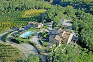 an aerial view of a house in a vineyard at Vin Santo in Castelnuovo Berardenga