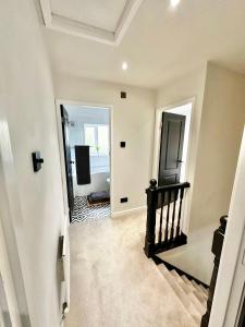 an empty hallway with a staircase in a house at Canal Mews in Manchester