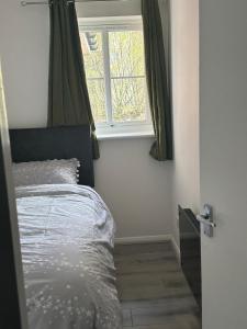 a bedroom with a bed and a window at Centre reache in Southend-on-Sea
