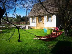 a hammock in a yard in front of a house at U Bieńka in Biały Dunajec