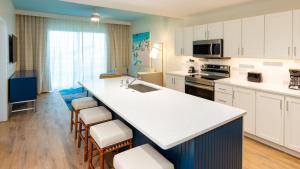a kitchen with a large white island in a room at Holiday Inn Club Vacations Myrtle Beach Oceanfront in Myrtle Beach