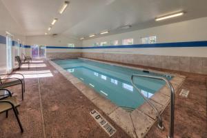 a swimming pool in a building with a pooliterator at Cottonwoods 477 in Moab