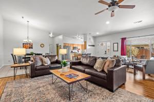 a living room with a couch and a table at Cottonwoods 477 in Moab