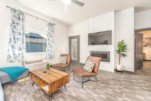 a living room with a couch and chairs at Manson Bay Suites in Manson