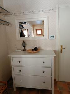 a dresser with a mirror on top of it at Nordic character in Vidsel +31 photos