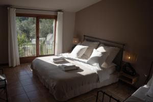 Posteľ alebo postele v izbe v ubytovaní Hotel Hort De Fortunyo