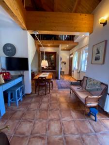 a living room with a couch and a table at Casa Gelasio Private Pool 