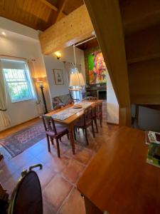 a dining room with a wooden table and chairs at Casa Gelasio Private Pool 