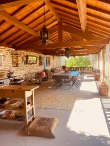 an outdoor patio with a table and chairs at Casa Gelasio Private Pool in Tourigo