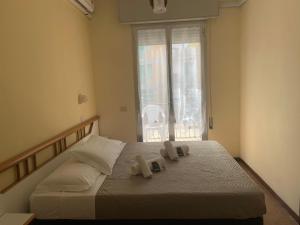 Postel nebo postele na pokoji v ubytování Hotel Majestic