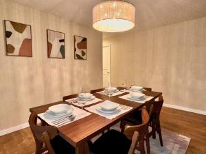 a dining room with a wooden table with chairs at Sunrise View in Rocklin