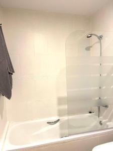 a shower with a glass door in a bathroom at Panoramic Seaview in Mijas