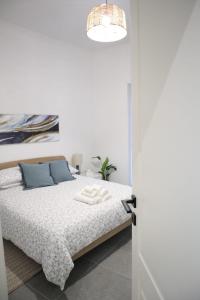 Postel nebo postele na pokoji v ubytování Wardija Maisonette