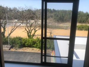 a view from a window of a field of water at Guesthouse Sunaen - Vacation STAY 49055v in Tottori