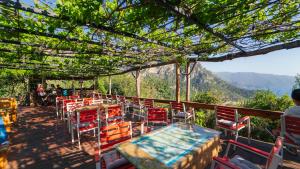 a restaurant with a view of the mountains at Shiva Camp in Faralya