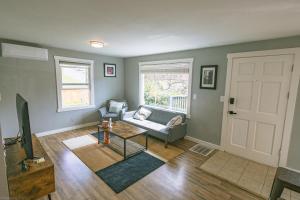 a living room with a couch and a table at Newly Furnished 4 bd & 2 bth Nearby Madison St in Seattle