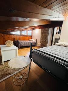 a bedroom with a bed and a table in it at Casa Mario in Riva del Garda