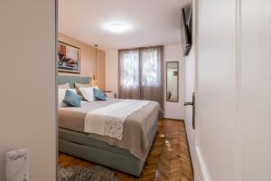 Posteľ alebo postele v izbe v ubytovaní Olive Shade - Apartment near the Beach