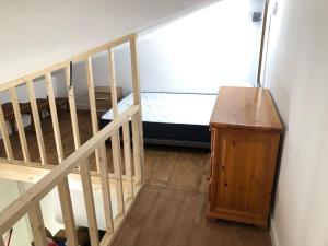 a room with a staircase and a wooden cabinet at CASTILLO CARAVACA PRINCIPAL in Caravaca de la Cruz +49 photos