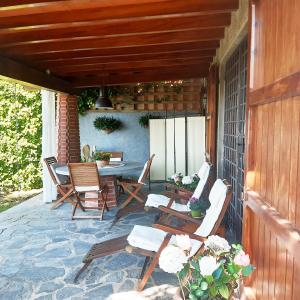a patio with a table and chairs on a house at Belvedere 10 in Pietrasanta