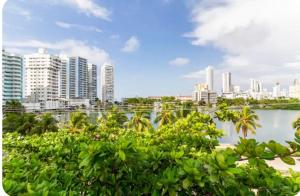 a view of a city skyline with tall buildings at Vista al lago en Cartagena in Cartagena de Indias